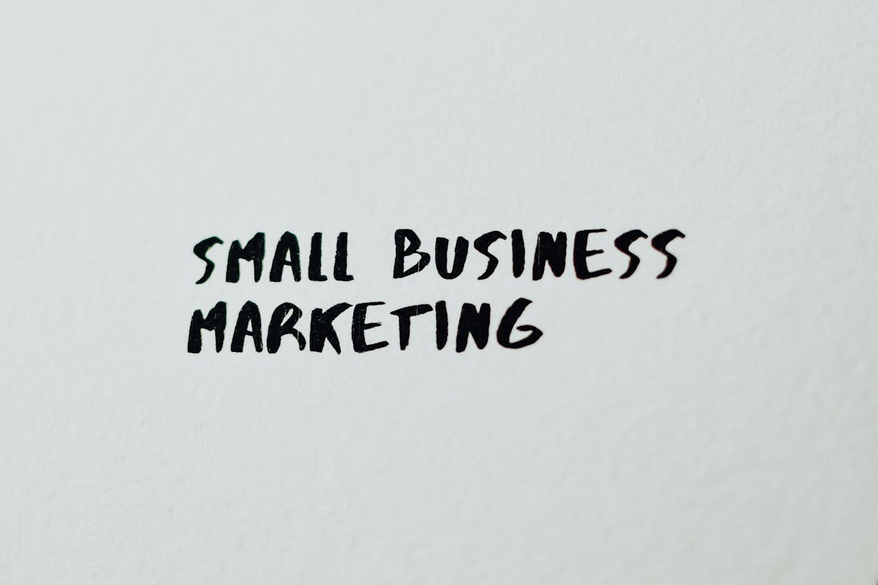 Text Small Business Marketing written on white paper for creative use.